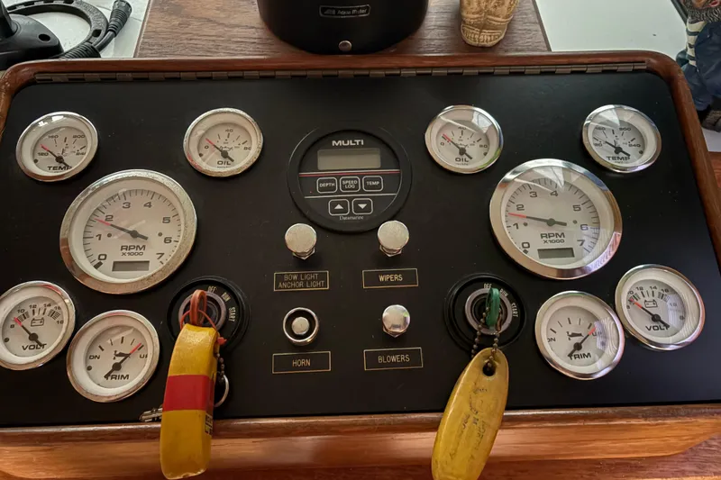 Slide: The Image of Control panel of a 1988 Cooper Prowler boat with gauges and switches. - 52