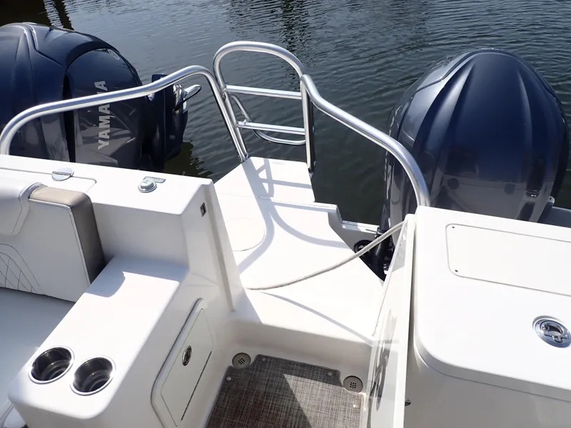 Slide: The Image of 2022 World Cat 325 DC boat with dual Yamaha engines and sleek deck design. - 19