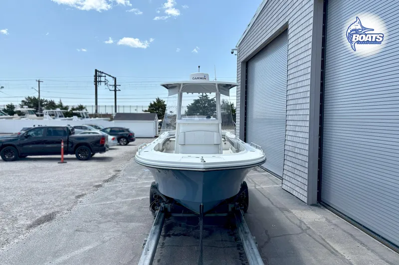 Slide: The Image of 2021 Parker 2300 Center Console boat on trailer outside a storage facility. - 2