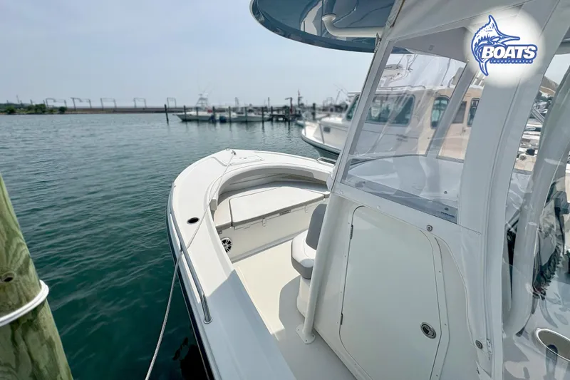 Slide: The Image of Parker 2300 Center Console boat docked at marina, 2021 model. - 4