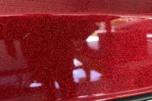 Slide: The Image of Close-up of 2022 Malibu Wakesetter 23 LSV's sparkling red exterior finish. - 10