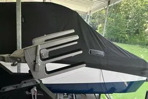 Slide: The Image of 2022 Malibu Wakesetter 23 LSV covered, parked under a canopy. - 18
