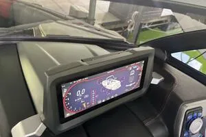 Slide: The Image of 2022 Malibu Wakesetter 23 LSV dashboard with digital display and controls. - 24