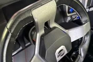 Slide: The Image of Steering wheel of 2022 Malibu Wakesetter 23 LSV boat, featuring sleek design and modern controls. - 25