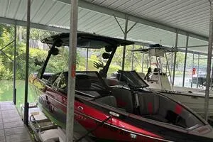 Slide: The Image of 2022 Malibu Wakesetter 23 LSV in a covered dock, side view. - 3