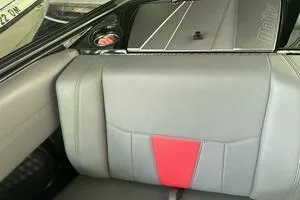 Slide: The Image of 2022 Malibu Wakesetter 23 LSV interior with gray and red upholstery detail. - 35