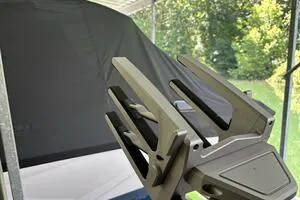 Slide: The Image of 2022 Malibu Wakesetter 23 LSV boat detail with cover, surrounded by greenery. - 37