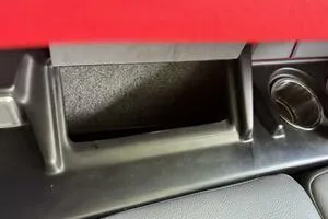 Slide: The Image of 2022 Malibu Wakesetter 23 LSV interior detail with cup holder and storage compartment. - 44