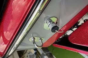 Slide: The Image of 2022 Malibu Wakesetter 23 LSV boat detail, featuring red and gray exterior with chrome fittings. - 45