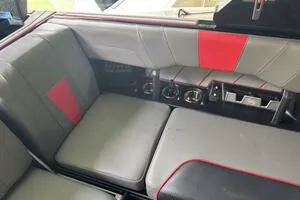 Slide: The Image of 2022 Malibu Wakesetter 23 LSV interior with gray and red seating, modern controls. - 48