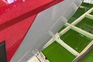 Slide: The Image of 2022 Malibu Wakesetter 23 LSV boat detail with red and gray exterior. - 8