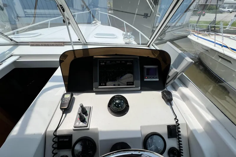 Slide: The Image of 2001 Mainship 34 PILOT helm with navigation equipment and controls. - 16