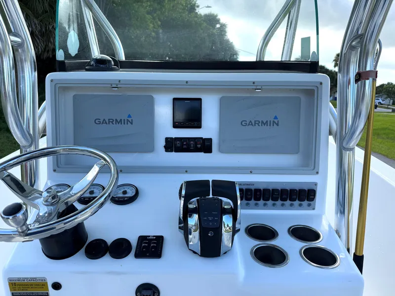 Slide: The Image of Control panel of a 2015 Bluewater 2550 boat with Garmin navigation system. - 10
