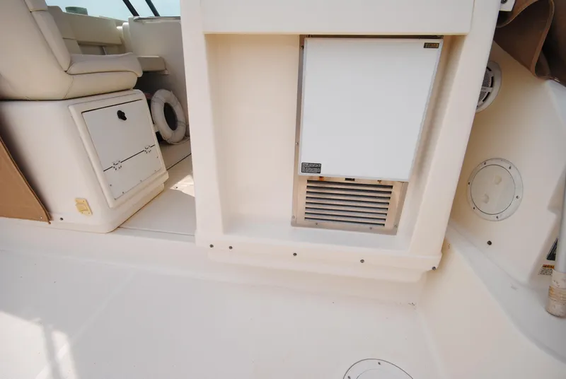 Slide: The Image of Interior of 1996 Tiara Yachts 3100 Open, featuring seating and storage compartments. - 7