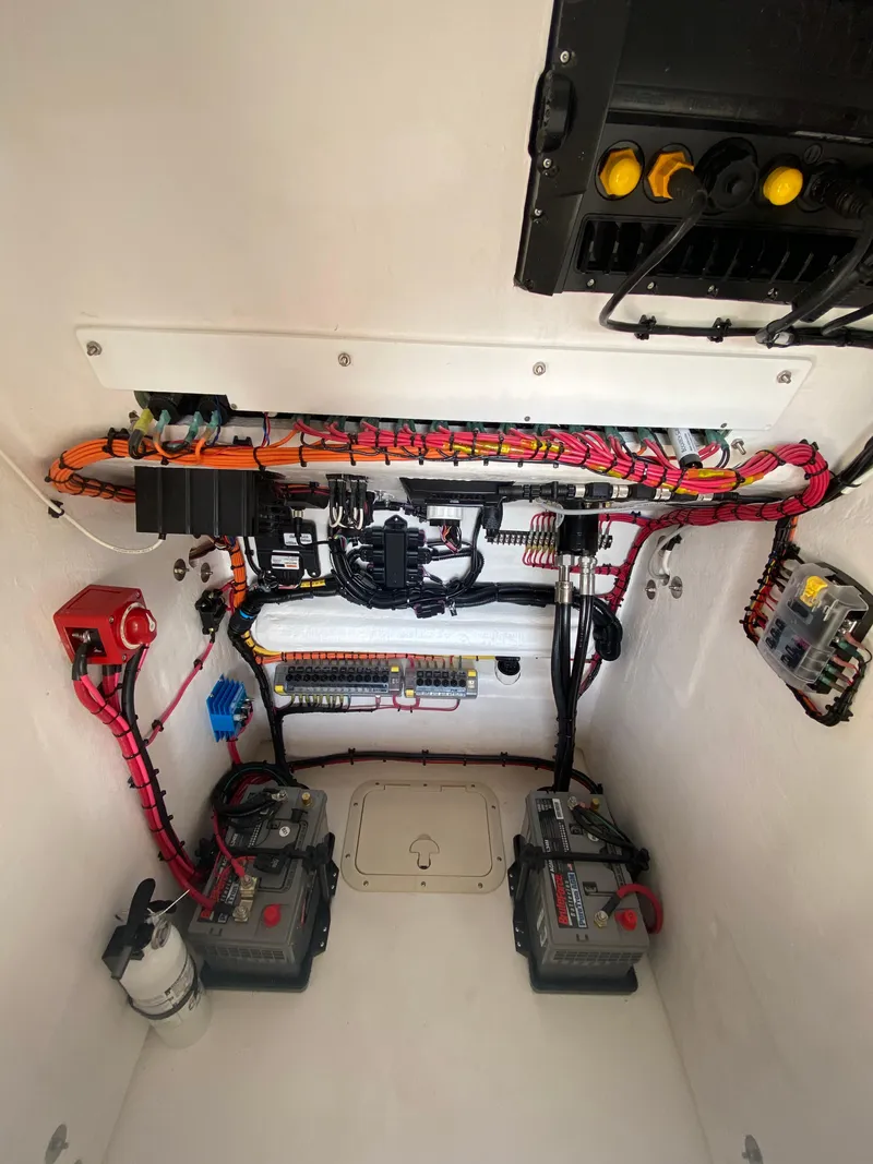 Slide: The Image of Electrical system of 2026 Reef Runner 230 boat, featuring batteries and wiring. - 15