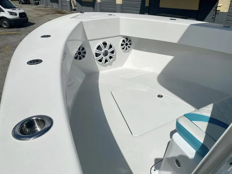 Slide: The Image of 2026 Reef Runner 230 boat interior with speakers and seating, showcasing modern design and functionality. - 3