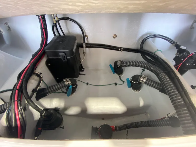 Slide: The Image of Interior view of 2026 Reef Runner 230 boat wiring and components. - 9