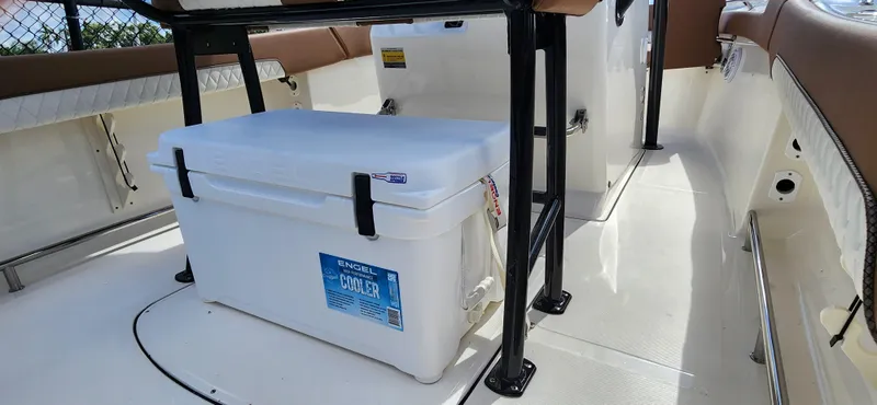 Slide: The Image of 2025 Pioneer 202 Islander boat interior with Engel cooler under seating. - 6