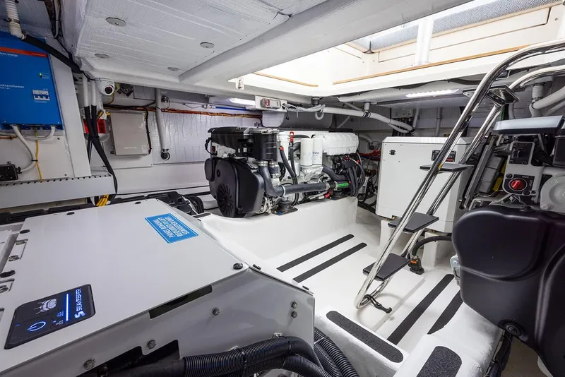 Slide: The Image of Engine room of 2026 Sabre 45 Salon Express yacht, showcasing modern equipment and design. - 16