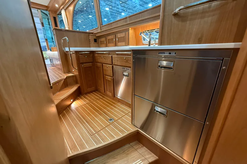 Slide: The Image of Luxurious interior of 2026 Sabre 45 Salon Express yacht with modern kitchen design. - 20