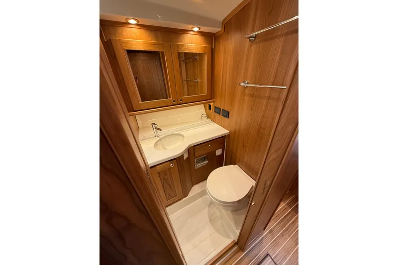 Slide: The Image of Luxurious bathroom in 2026 Sabre 45 Salon Express yacht with wooden cabinetry. - 25