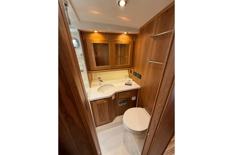 Slide: The Image of Luxurious bathroom in 2026 Sabre 45 Salon Express yacht with wood accents and modern fixtures. - 34