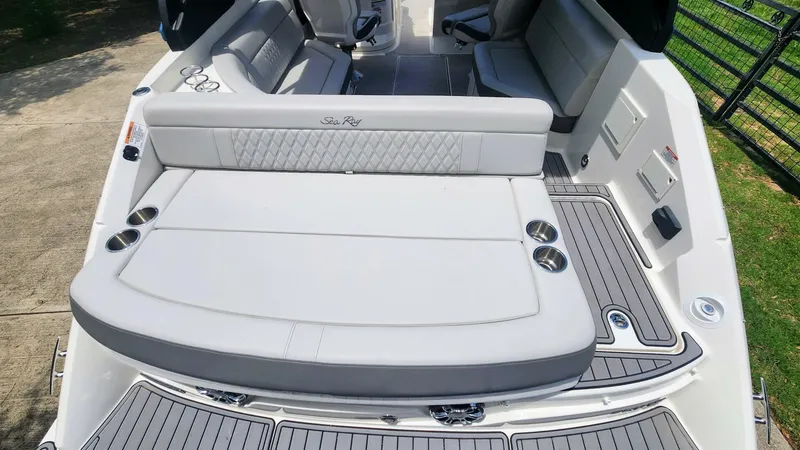 Slide: The Image of 2021 Sea Ray SLX 250 boat interior with spacious seating and cup holders. - 11