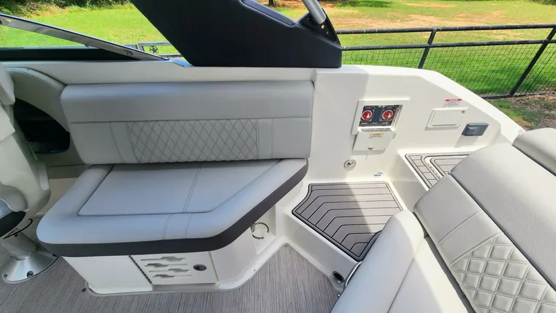Slide: The Image of 2021 Sea Ray SLX 250 interior with luxurious seating and modern design features. - 12