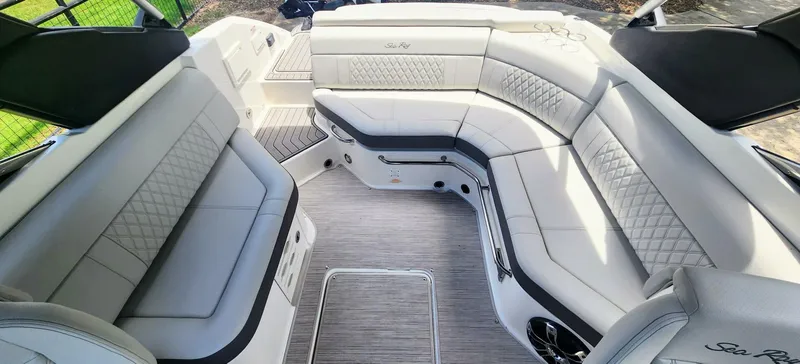 Slide: The Image of Luxurious interior of 2021 Sea Ray SLX 250 boat with elegant seating and modern design. - 13