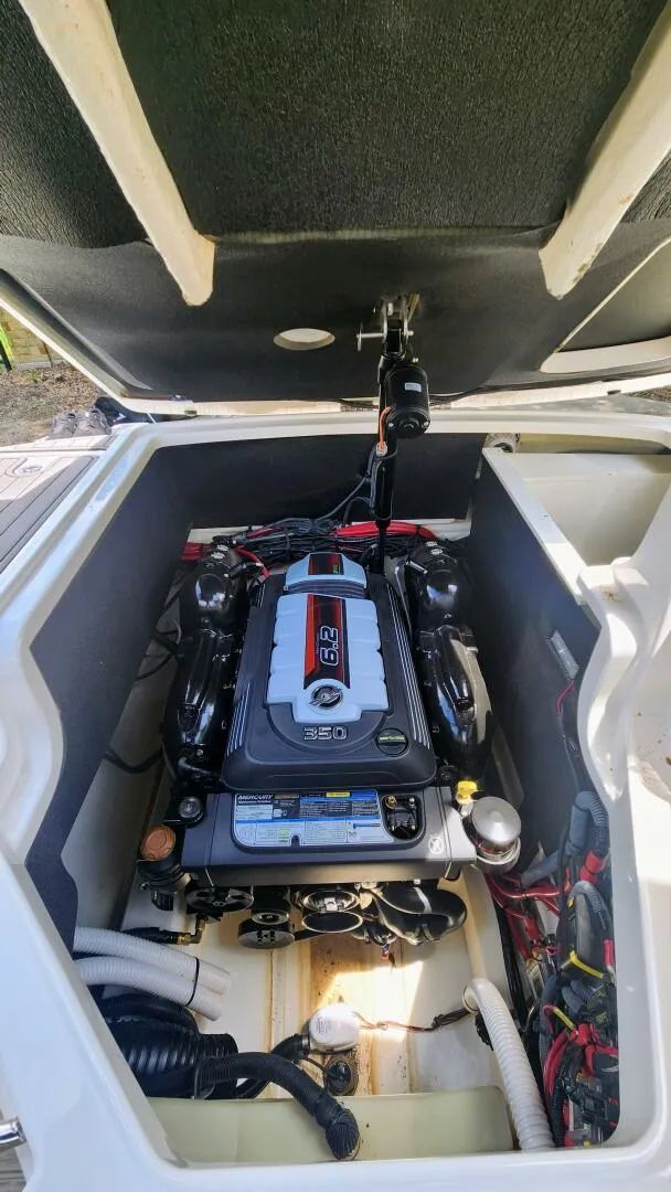 Slide: The Image of 2021 Sea Ray SLX 250 engine compartment showcasing powerful 6.2L engine. - 18