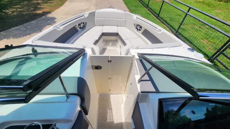 Slide: The Image of 2021 Sea Ray SLX 250 boat interior with open bow seating and modern design. - 23