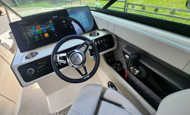 Slide: The Image of 2021 Sea Ray SLX 250 helm with modern controls and digital displays. - 4
