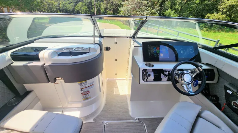 Slide: The Image of Interior view of 2021 Sea Ray SLX 250 boat cockpit with modern controls and seating. - 5