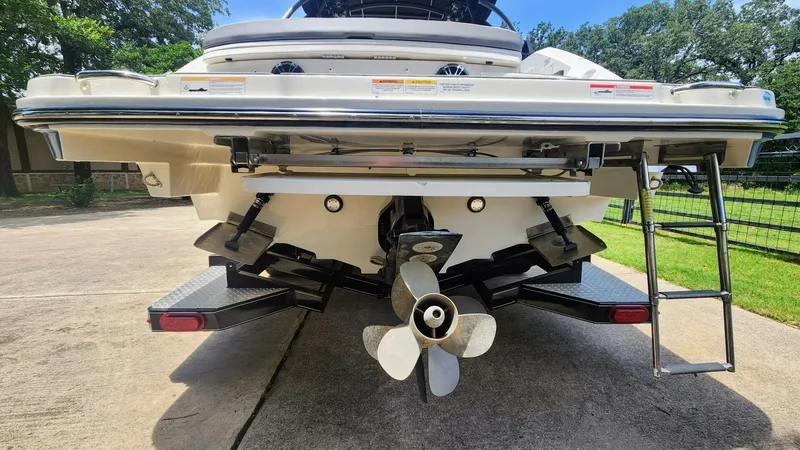Slide: The Image of Rear view of a 2021 Sea Ray SLX 250 boat with propeller and ladder. - 9