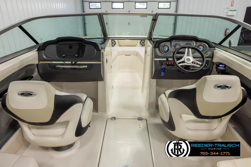 Slide: The Image of Interior of a 2016 Chaparral 216 SSi boat with dual seats and steering console. - 13