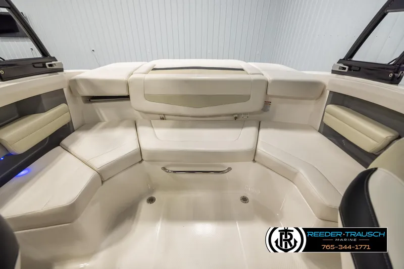 Slide: The Image of 2016 Chaparral 216 SSi boat interior with white seating and modern design. - 18