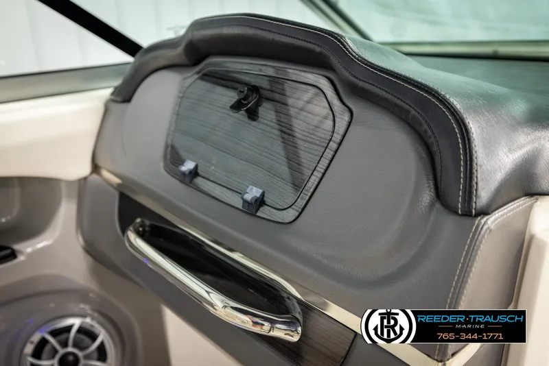 Slide: The Image of Interior of 2016 Chaparral 216 SSi boat with speaker and storage compartment. - 21