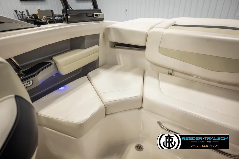 Slide: The Image of 2016 Chaparral 216 SSi boat interior with white seating and modern design. - 25