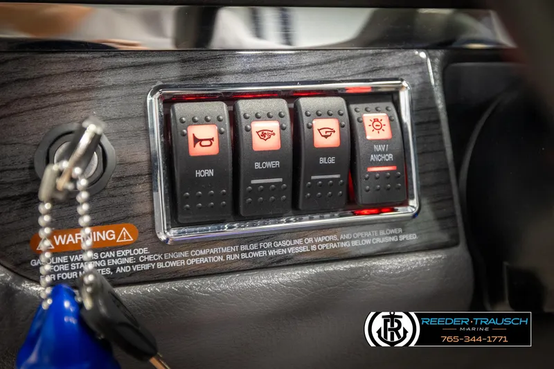 Slide: The Image of Control panel of a 2016 Chaparral 216 SSi boat with labeled switches. - 30