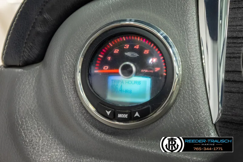 Slide: The Image of Dashboard of 2016 Chaparral 216 SSi showing RPM gauge and trip hours. - 31