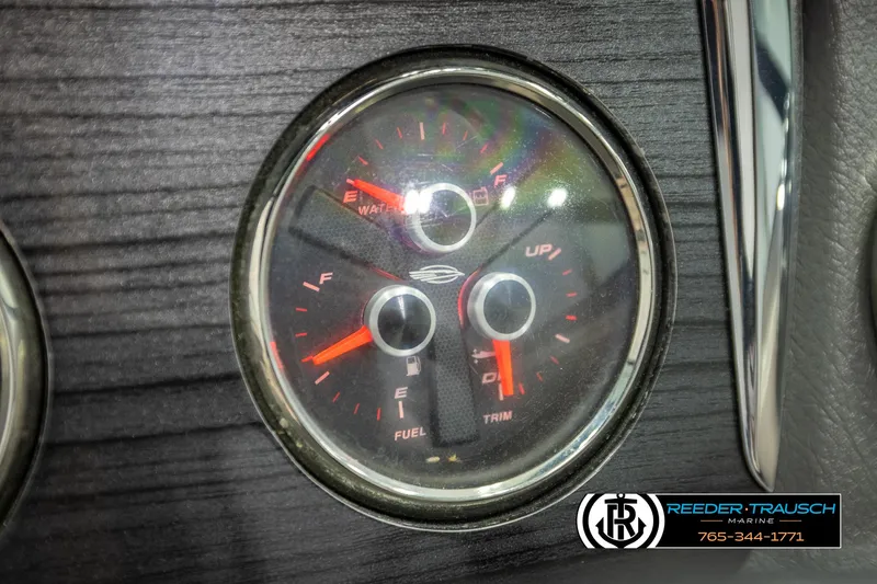 Slide: The Image of Dashboard gauge of 2016 Chaparral 216 SSi boat, showing fuel and trim levels. - 33