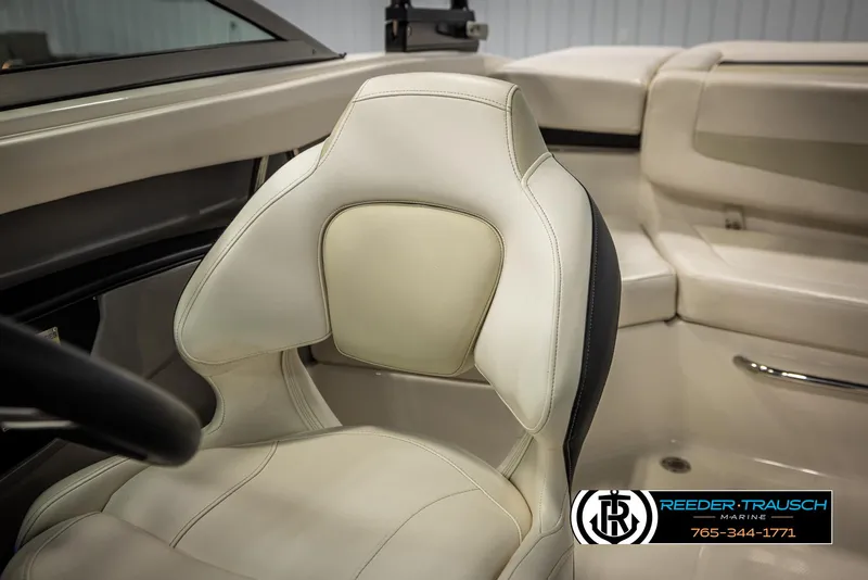 Slide: The Image of 2016 Chaparral 216 SSi boat interior with cream leather seating. - 38