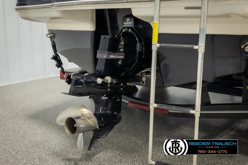 Slide: The Image of 2016 Chaparral 216 SSi boat stern with MerCruiser outdrive and ladder. - 49