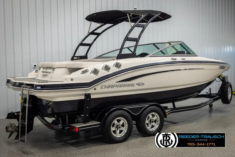 Slide: The Image of 2016 Chaparral 216 SSi boat on trailer in showroom, side view. - 5