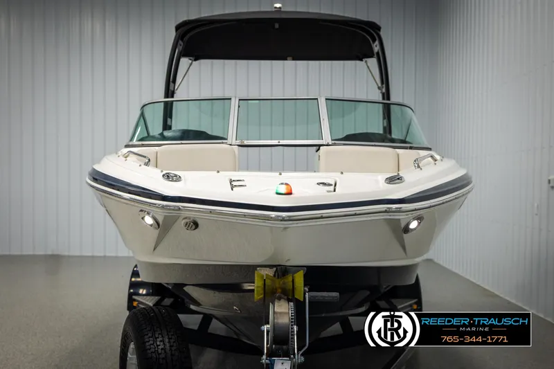 Slide: The Image of 2016 Chaparral 216 SSi boat on trailer in indoor showroom. - 7