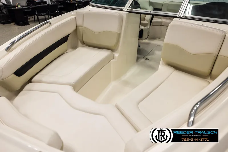 Slide: The Image of Interior of 2016 Chaparral 216 SSi boat with beige seating and chrome accents. - 9