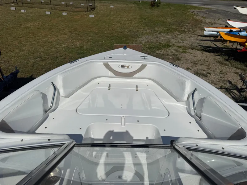 Slide: The Image of 2012 Sea Hunt Escape 188LE boat interior with seating and open deck. - 5