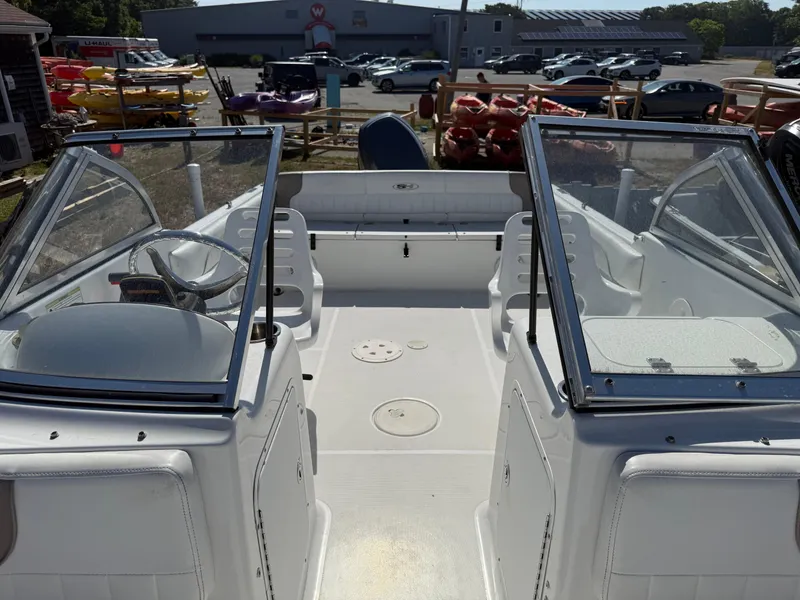Slide: The Image of 2012 Sea Hunt Escape 188LE boat interior with dual consoles and seating. - 6