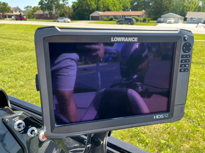 Slide: The Image of Lowrance HDS12 fishfinder on 2022 Alumacraft Pro 175 boat, reflecting surroundings. - 11