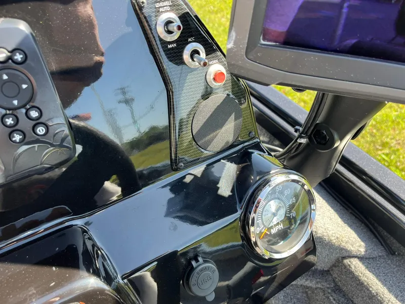 Slide: The Image of Dashboard of a 2022 Alumacraft Pro 175 boat with speedometer and control panel. - 12